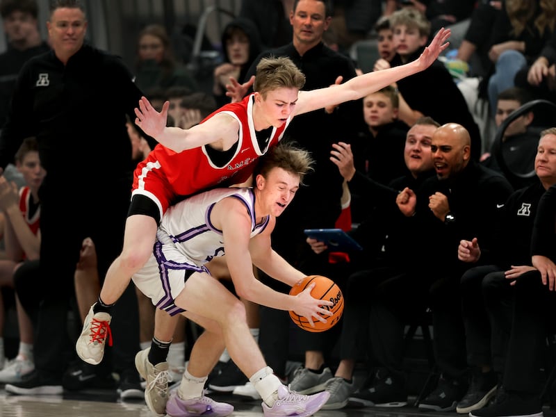 American Fork’s Tiger Cuff falls onto Lehi’s Jace John at Lehi High School on Friday, Jan. 12, 2024.