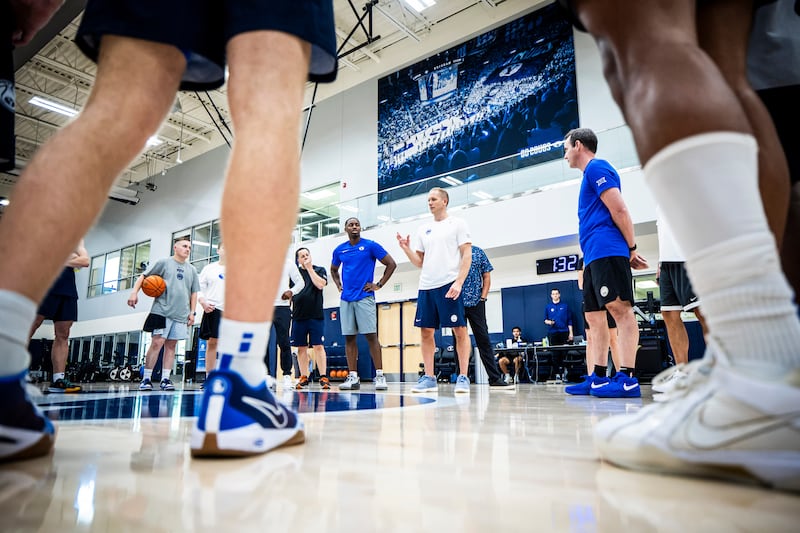 BYU players listen to coach Kevin Young during practice at the Marriott Center Annex on June 6, 2024, in Provo.