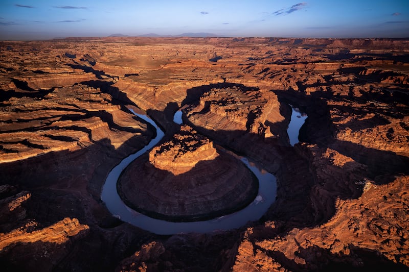 The Colorado River cuts its path through southern Utah near Moab on Friday.